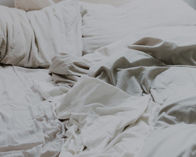 mussed sheets in a bed