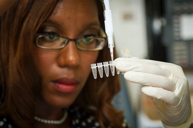 Lab technician performing genetic test