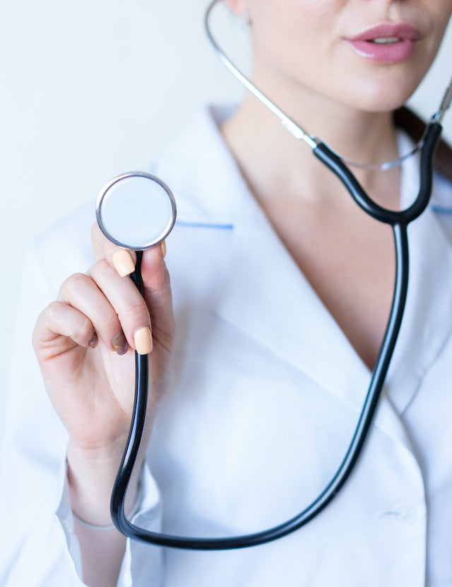 gynecologist holding a stethoscope 