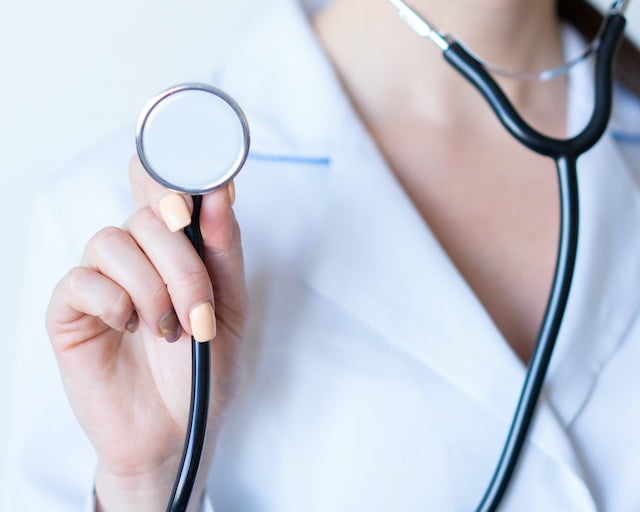gynecologist holding a stethoscope 