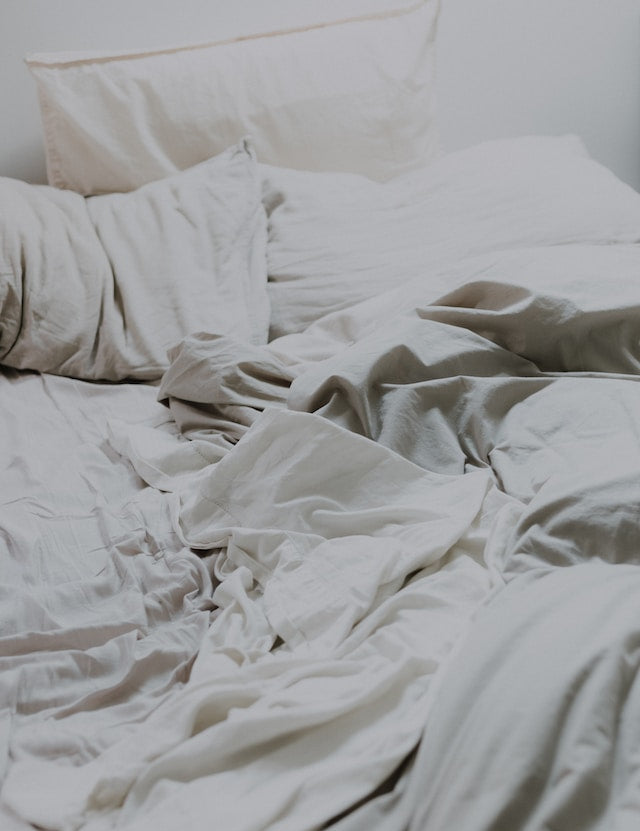 mussed sheets in a bed