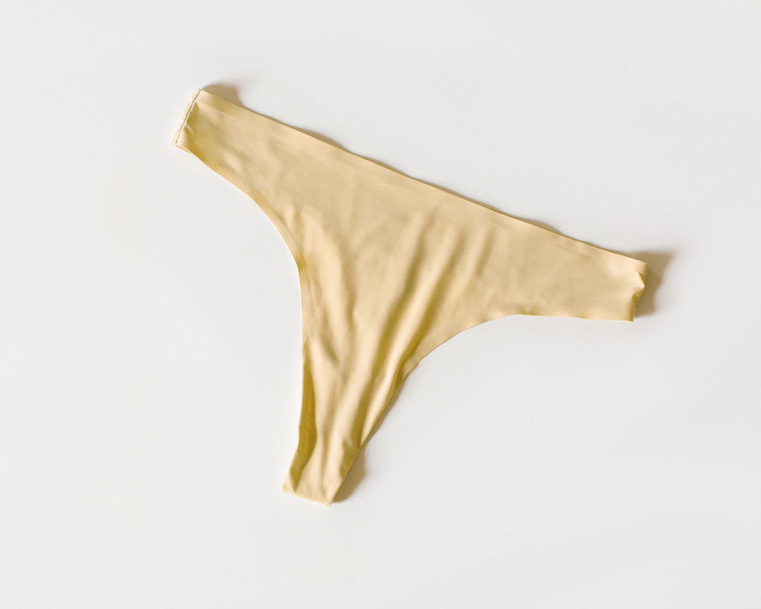 a thong in pale yellow