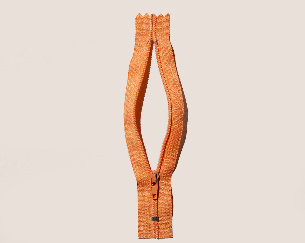 open zipper to suggest the female anatomy