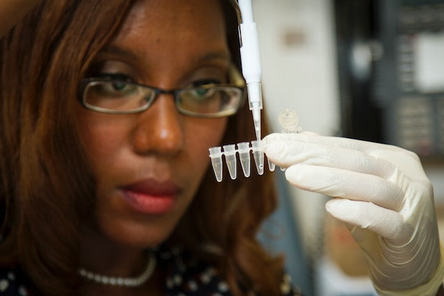 Lab technician performing genetic test