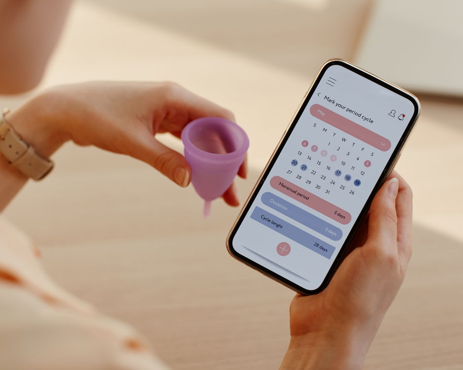 woman uses app to track her menstrual cycle