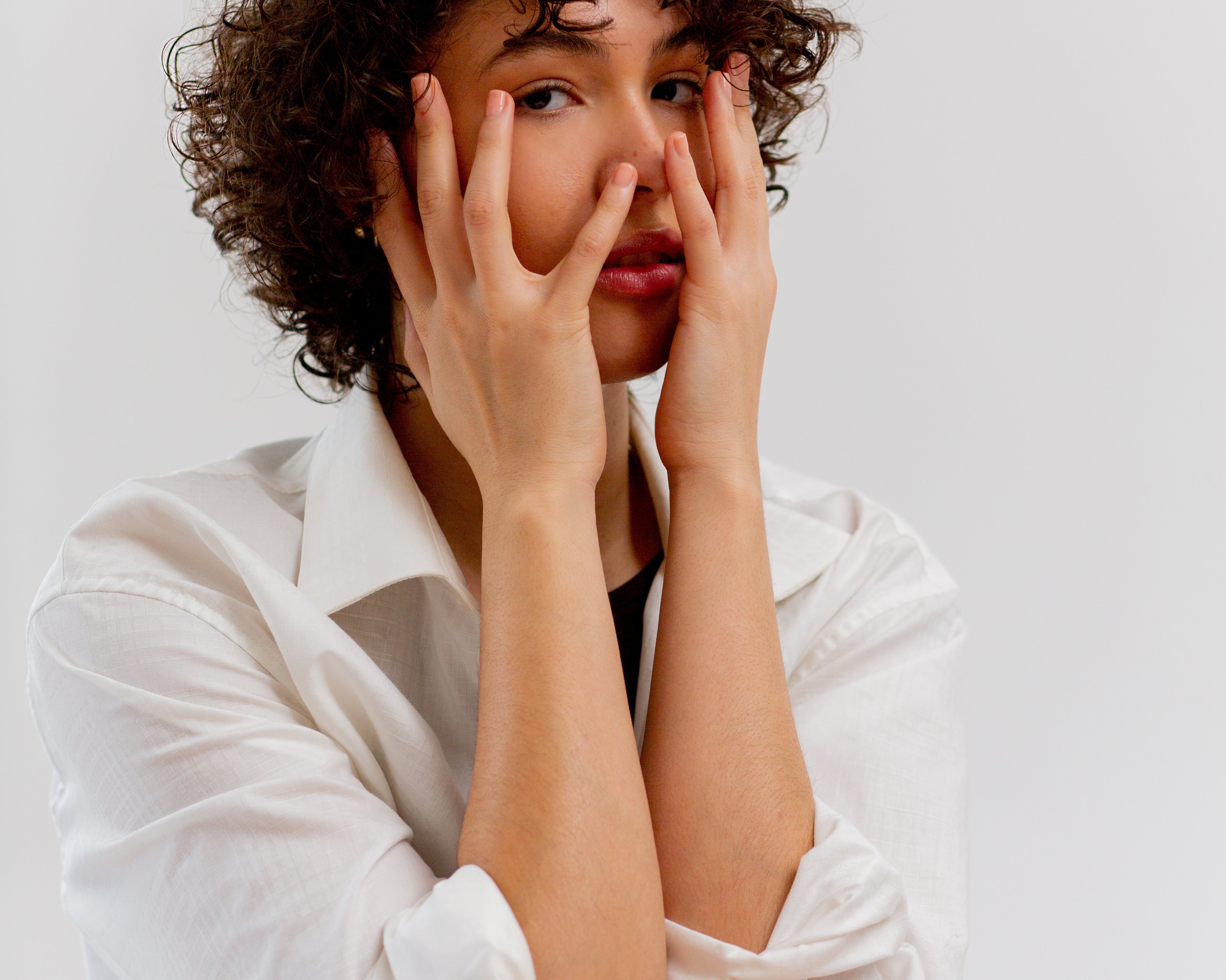 Woman covering her face