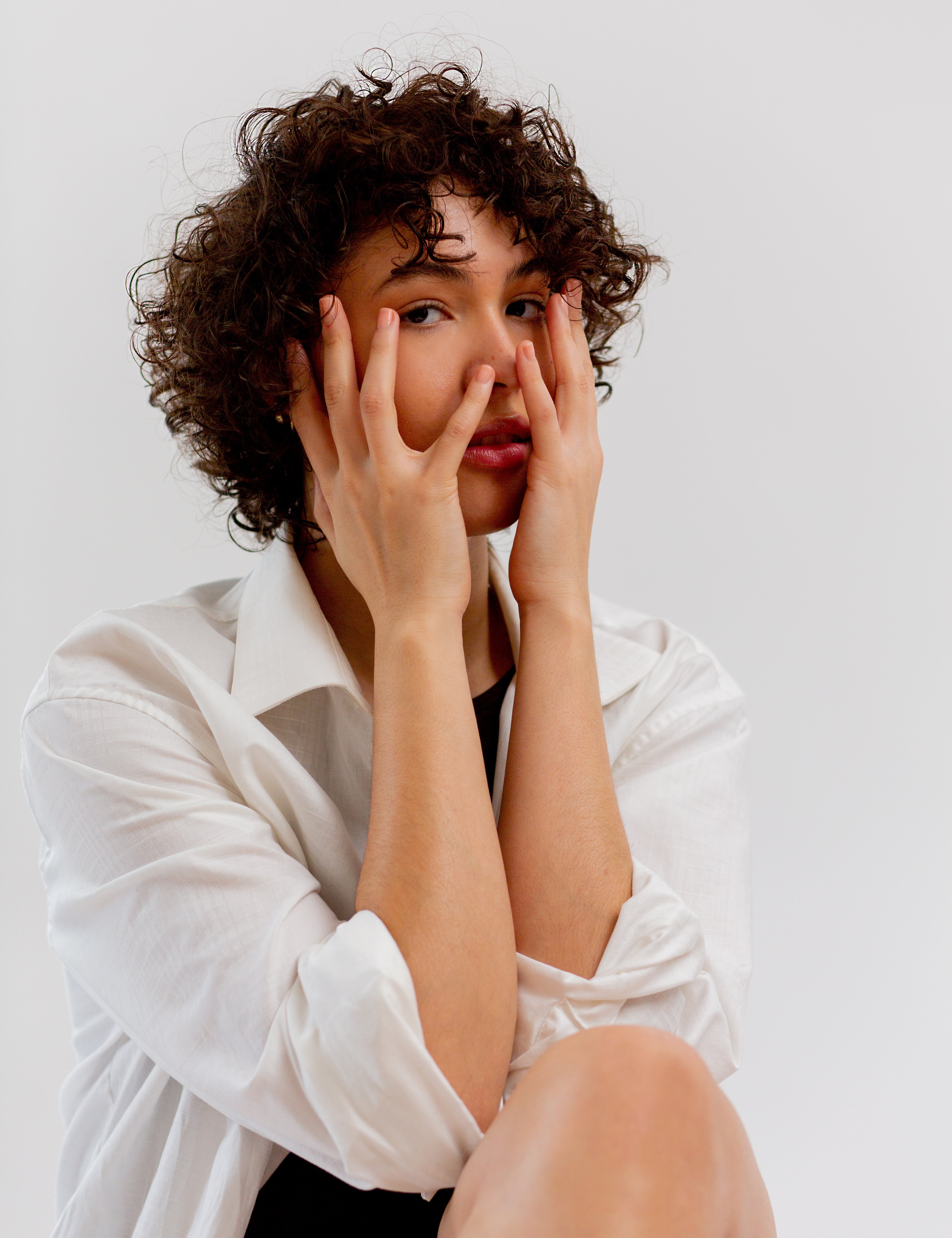 Woman covering her face